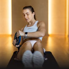 Woman doing a core workout in a Dubai gym