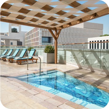 Small shaded kids' pool at Alwadi Hotel Doha - MGallery. 