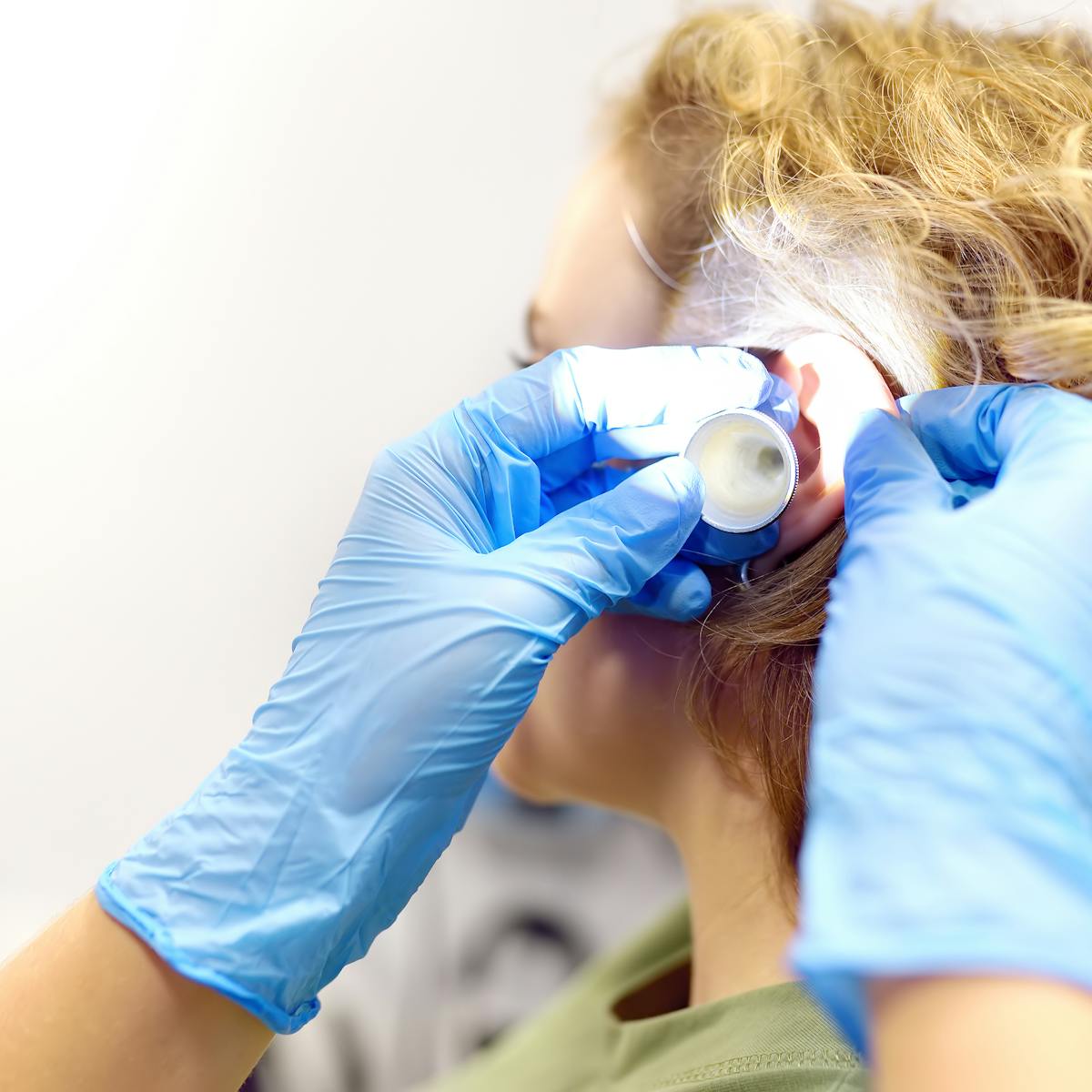 a professional ent doctor examines a patient