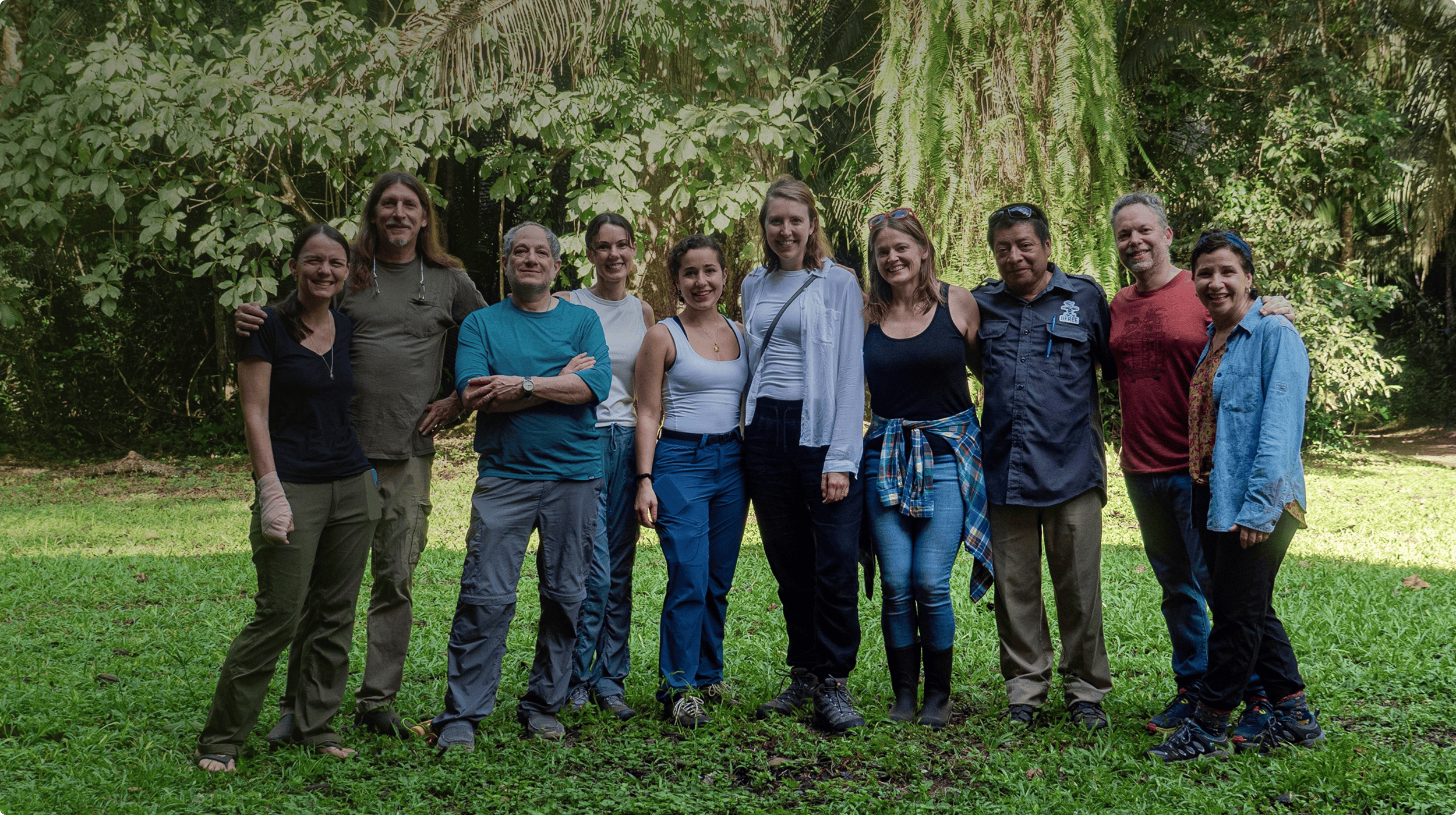 The HCP management team gathered in a tropical forest.