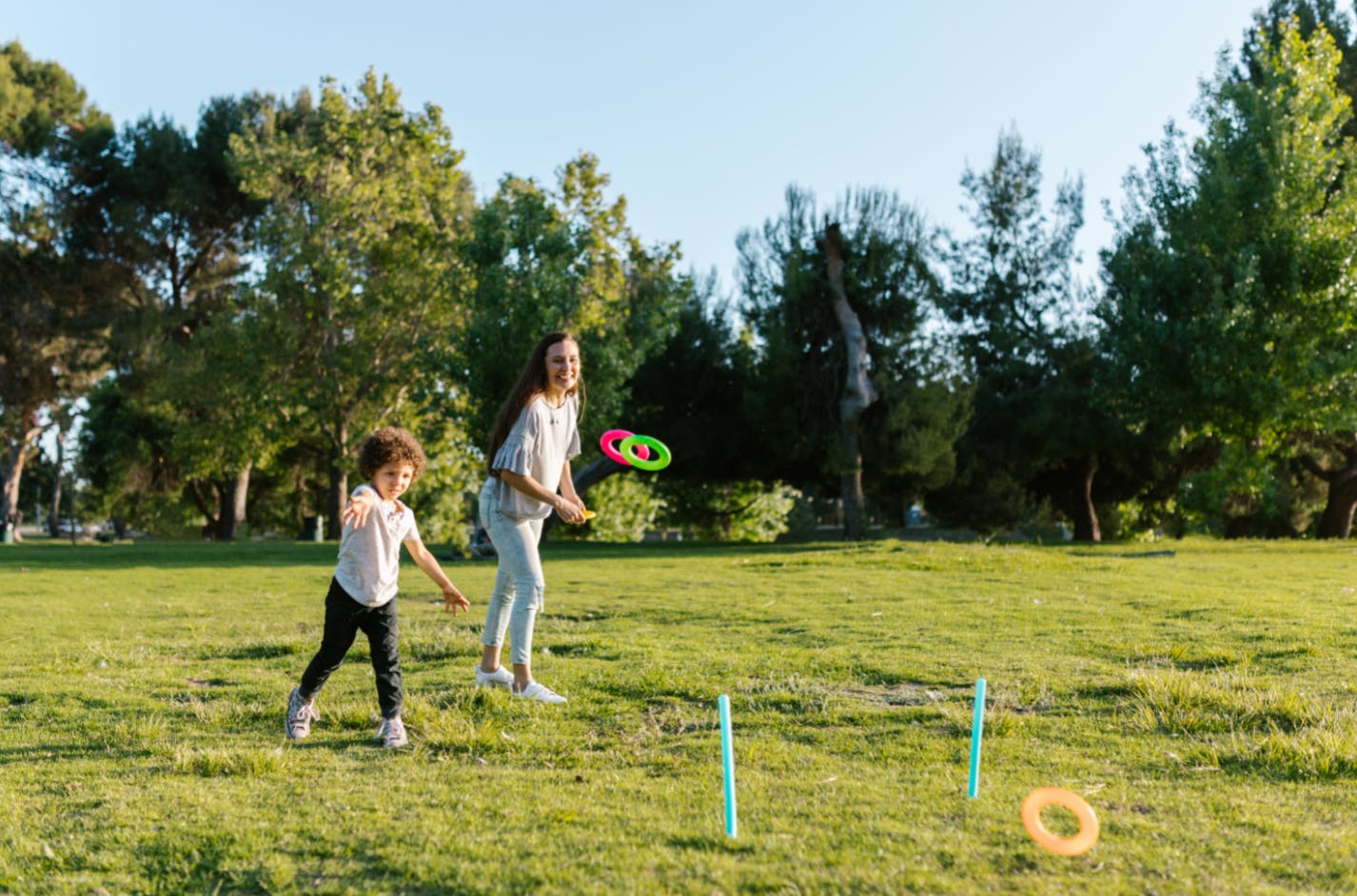 Child and adult playing a game outside to get a break from school and avoid boredom