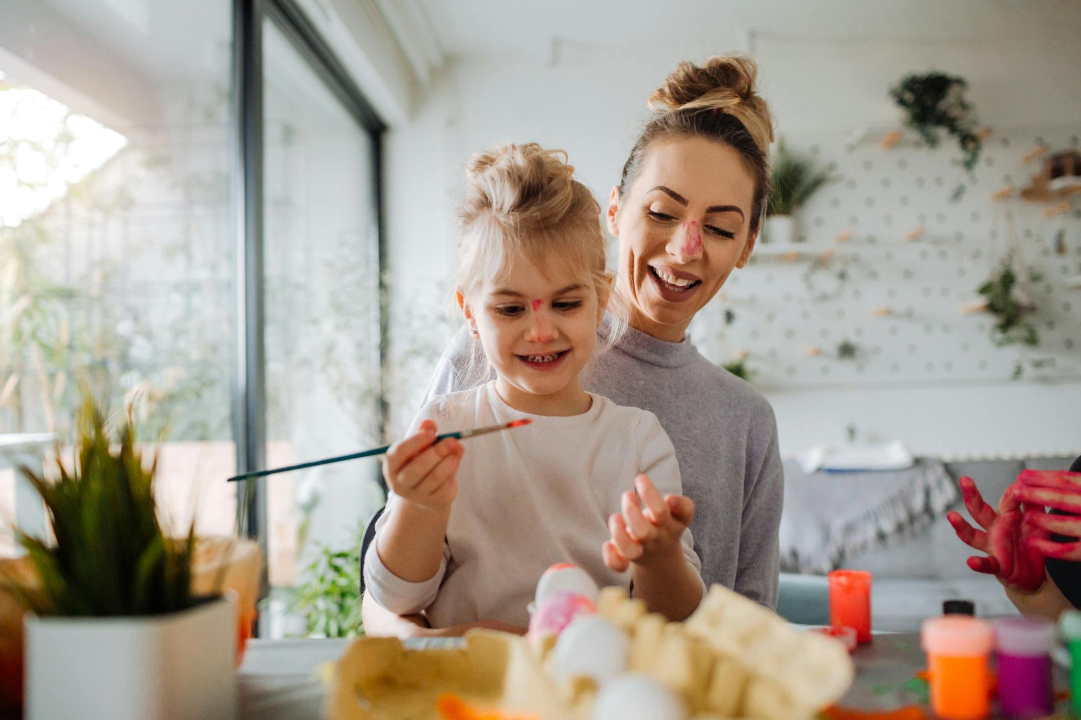 Mother and daughter doing a craft together, after setting a goal to make time for artistic pursuits.