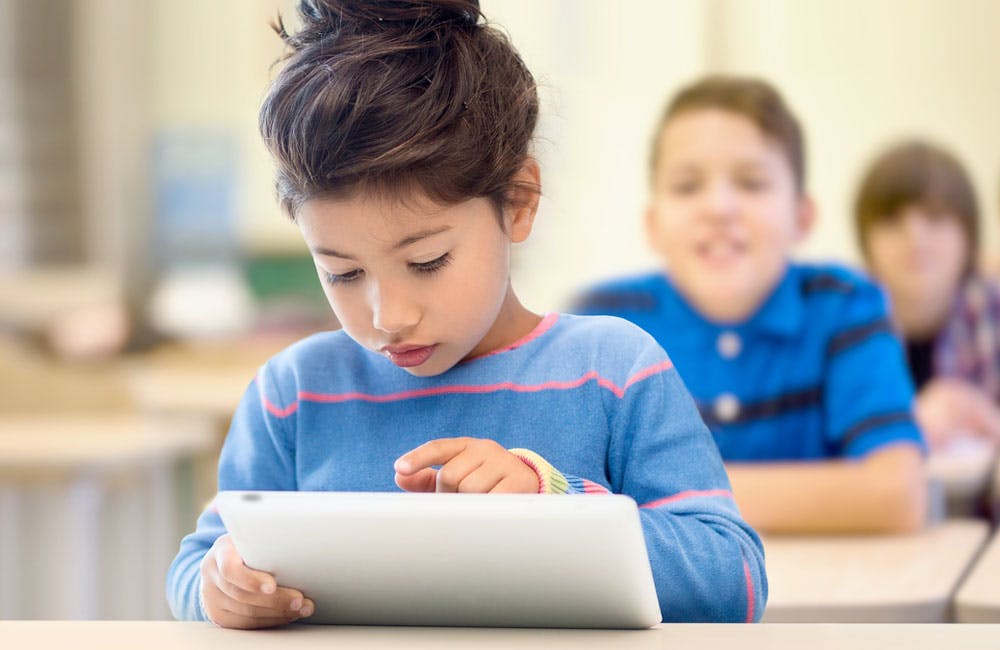 Girl learning on a tablet