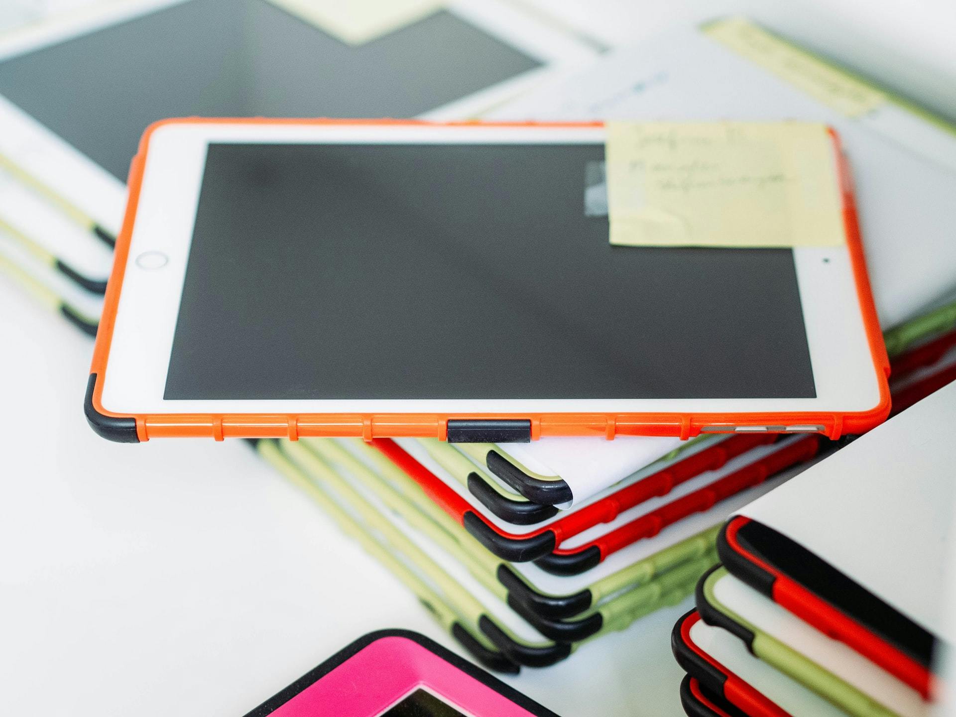 Stack of classroom tablets for online learning.