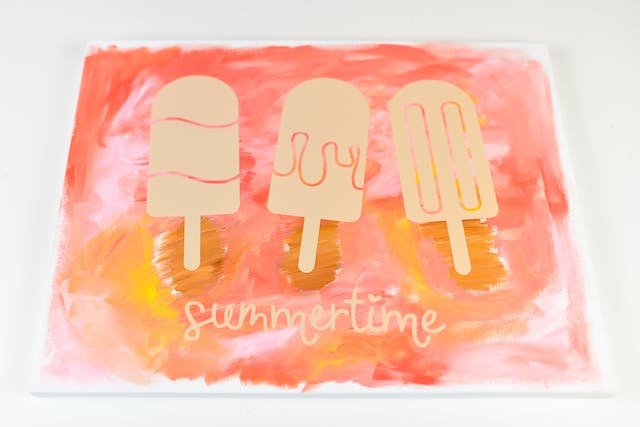 A "hot mess canvas" painting with popsicles on it from Hey, Let’s Make Stuff