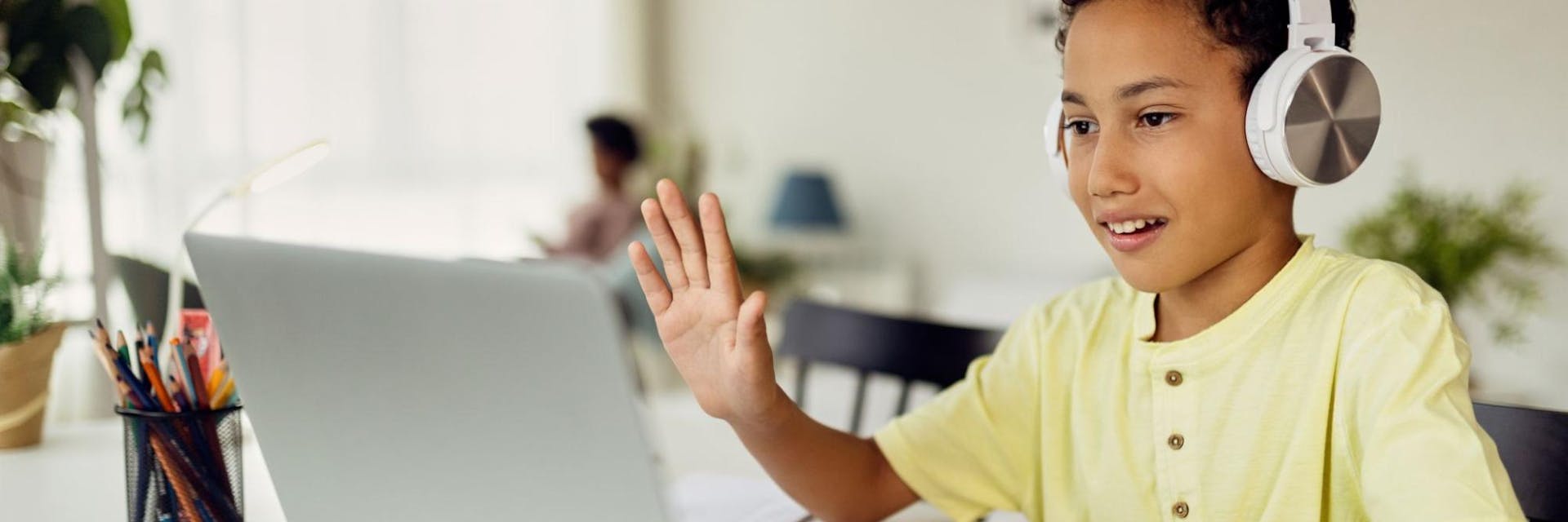 Young student learning from home with an online learning platform.