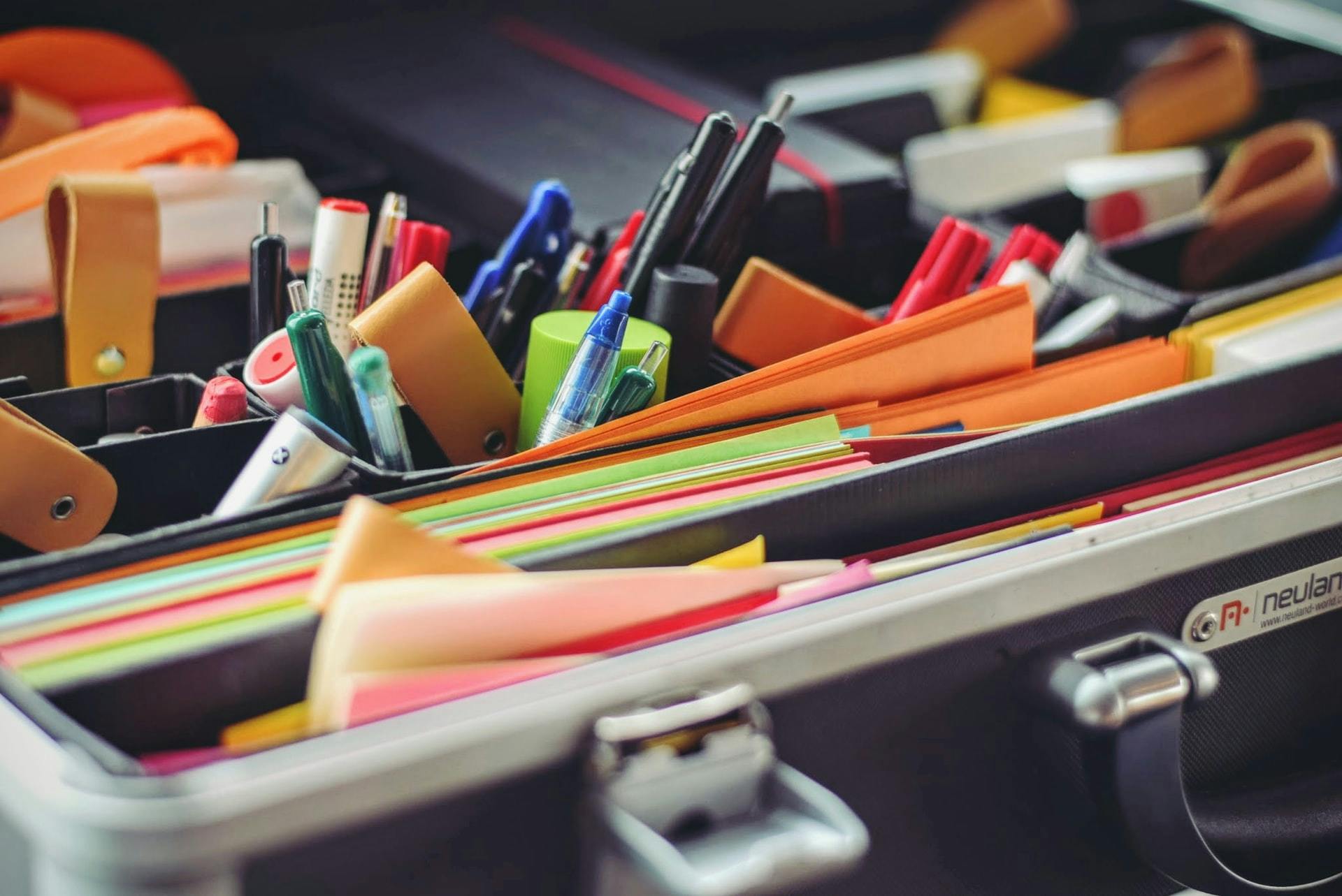 Box of papers, pens and other supplies for lesson planning. 