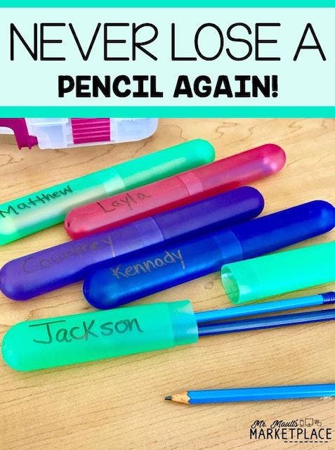 Toothbrush holders labeled with student names for holding pencils.