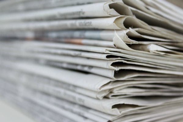 A stack of newspapers.