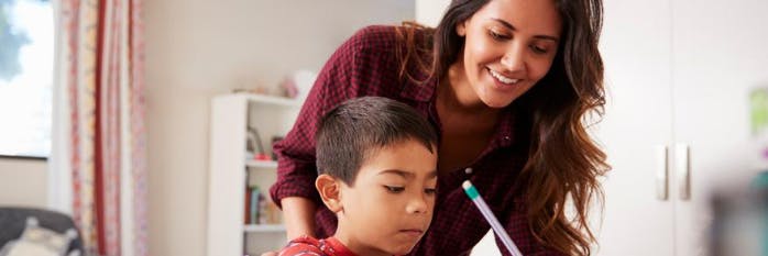 parent being involved in child's homework as he studies