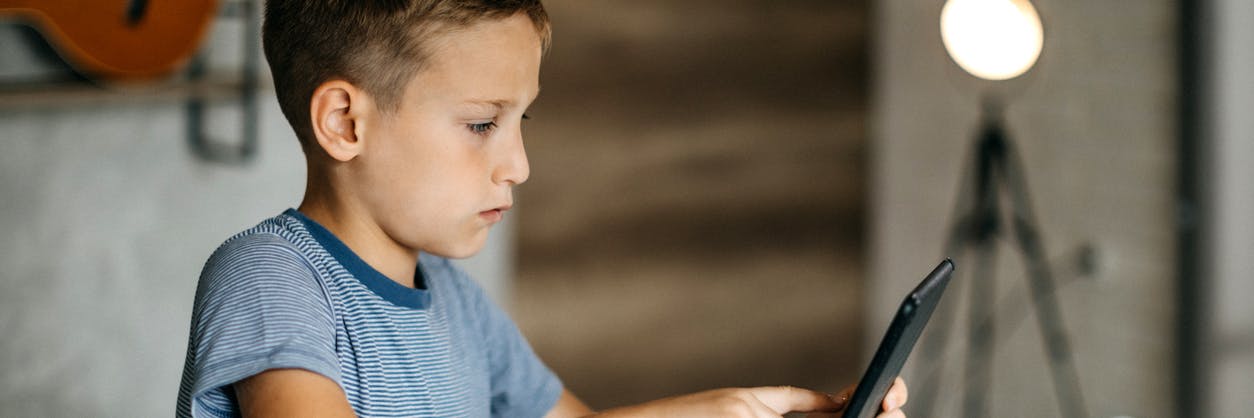 Child working on a math intervention program on his tablet.