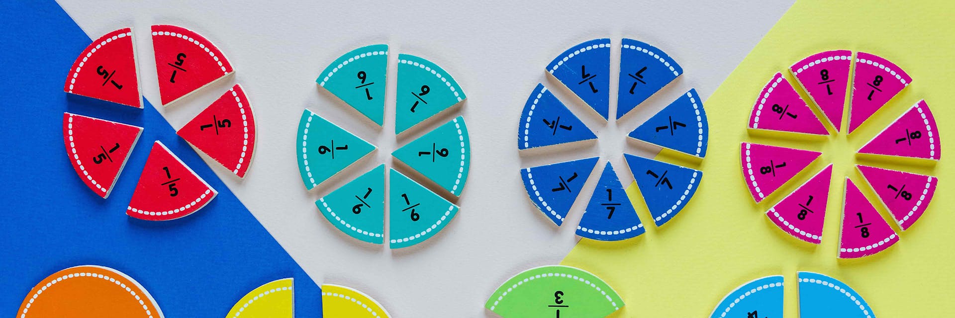 Fraction circles being used as math manipulatives.