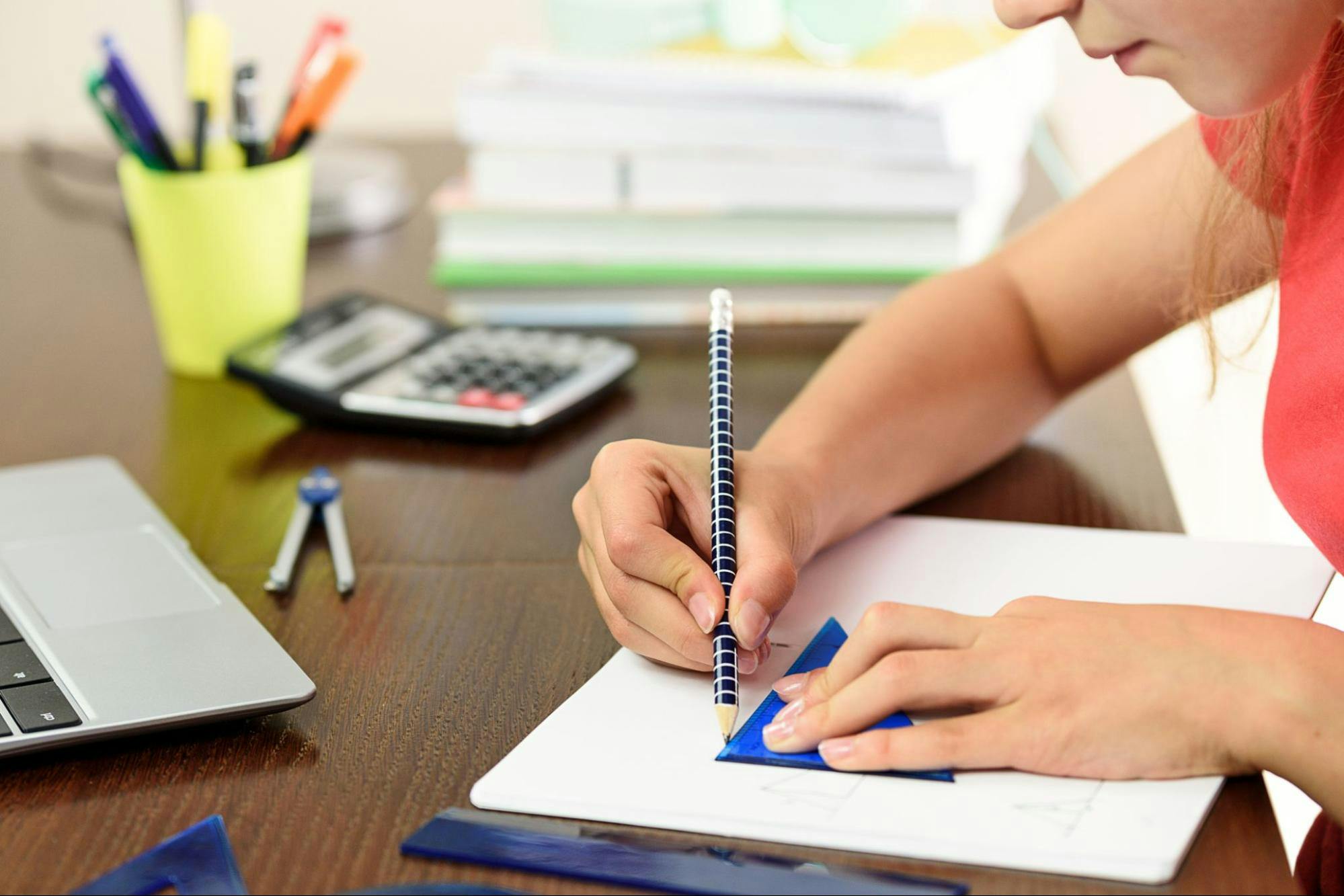 A student uses geometry tools