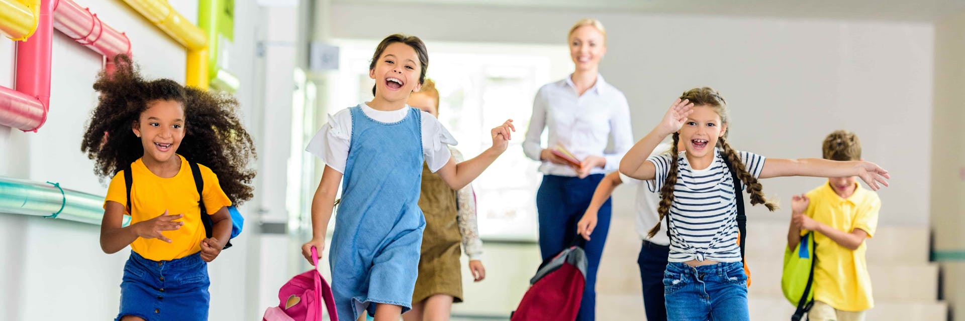 Students celebrate the end of the school year in hall.