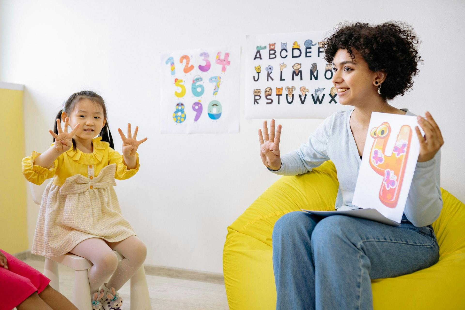 Teacher and student practicing numbers together