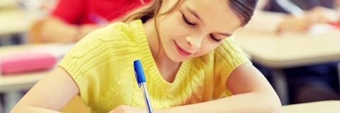 A student completing a formative assessment in class.