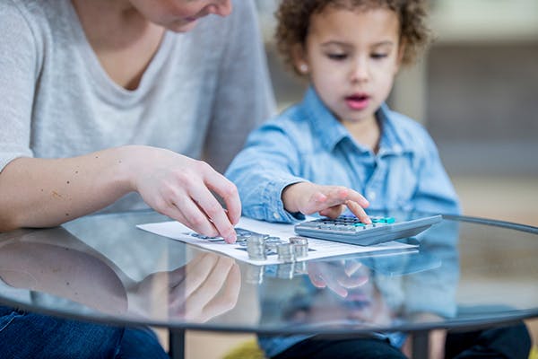 Child and teacher use reciprocal teaching strategies to learn how to read.