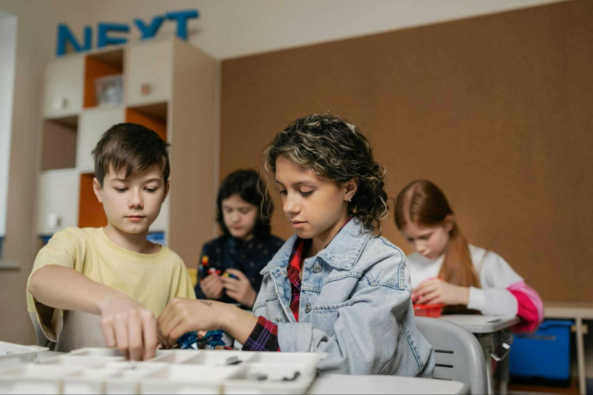 Students work on a project together in the classroom.