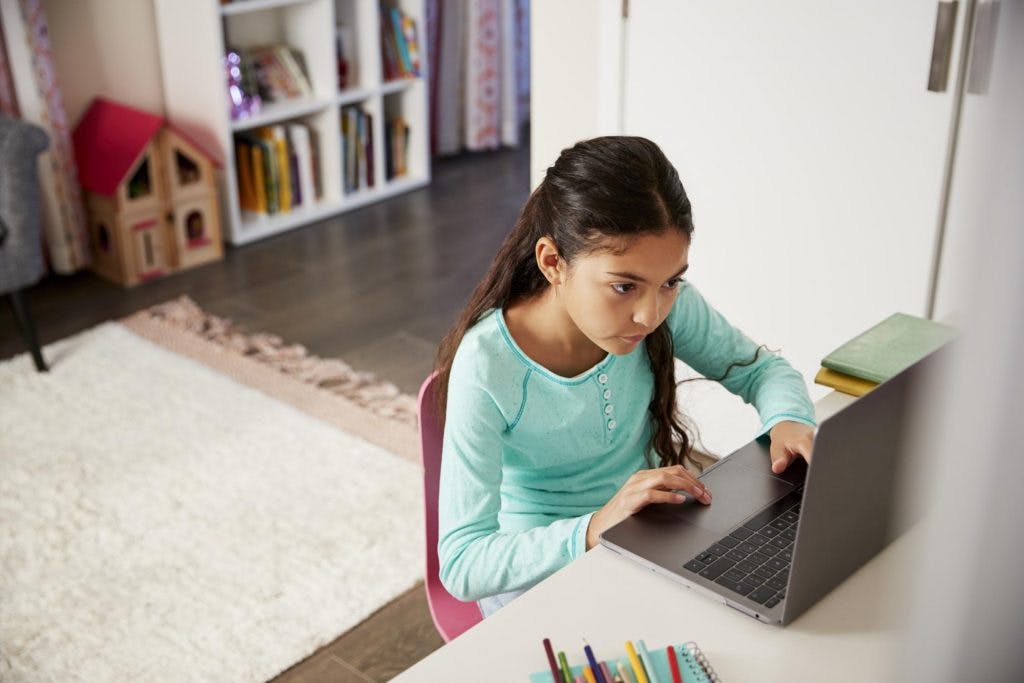 Child doing an after school program on her computer