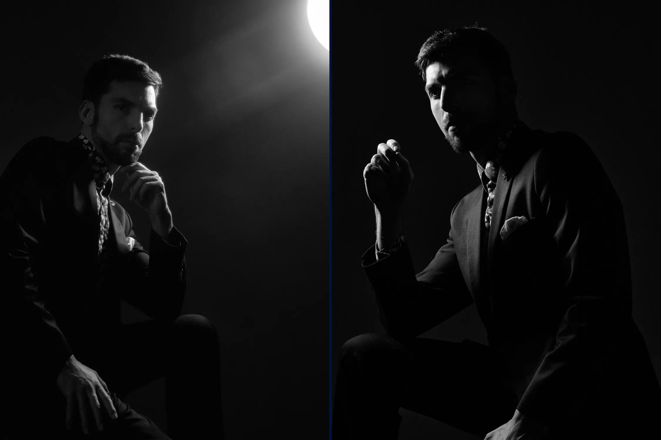 Black and white editorial portrait of Mitchell in a sharp suit and pocket square, lit with a hard reflector for cinematic contrast