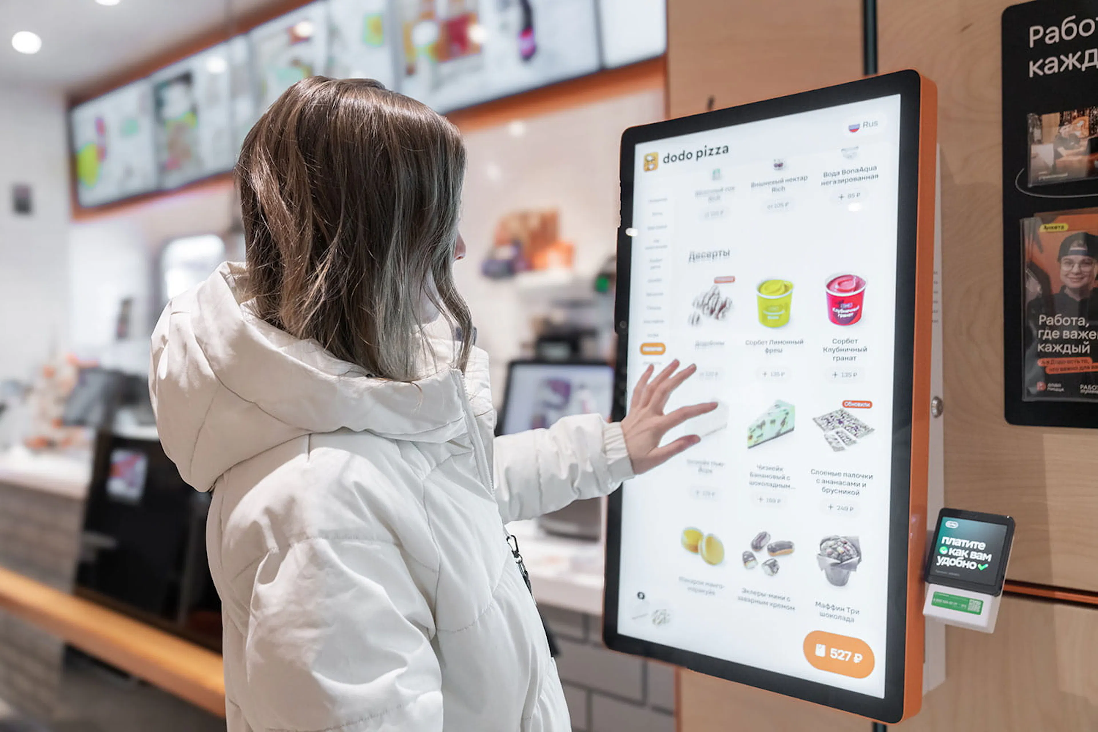 customer ordering at quick service digital display