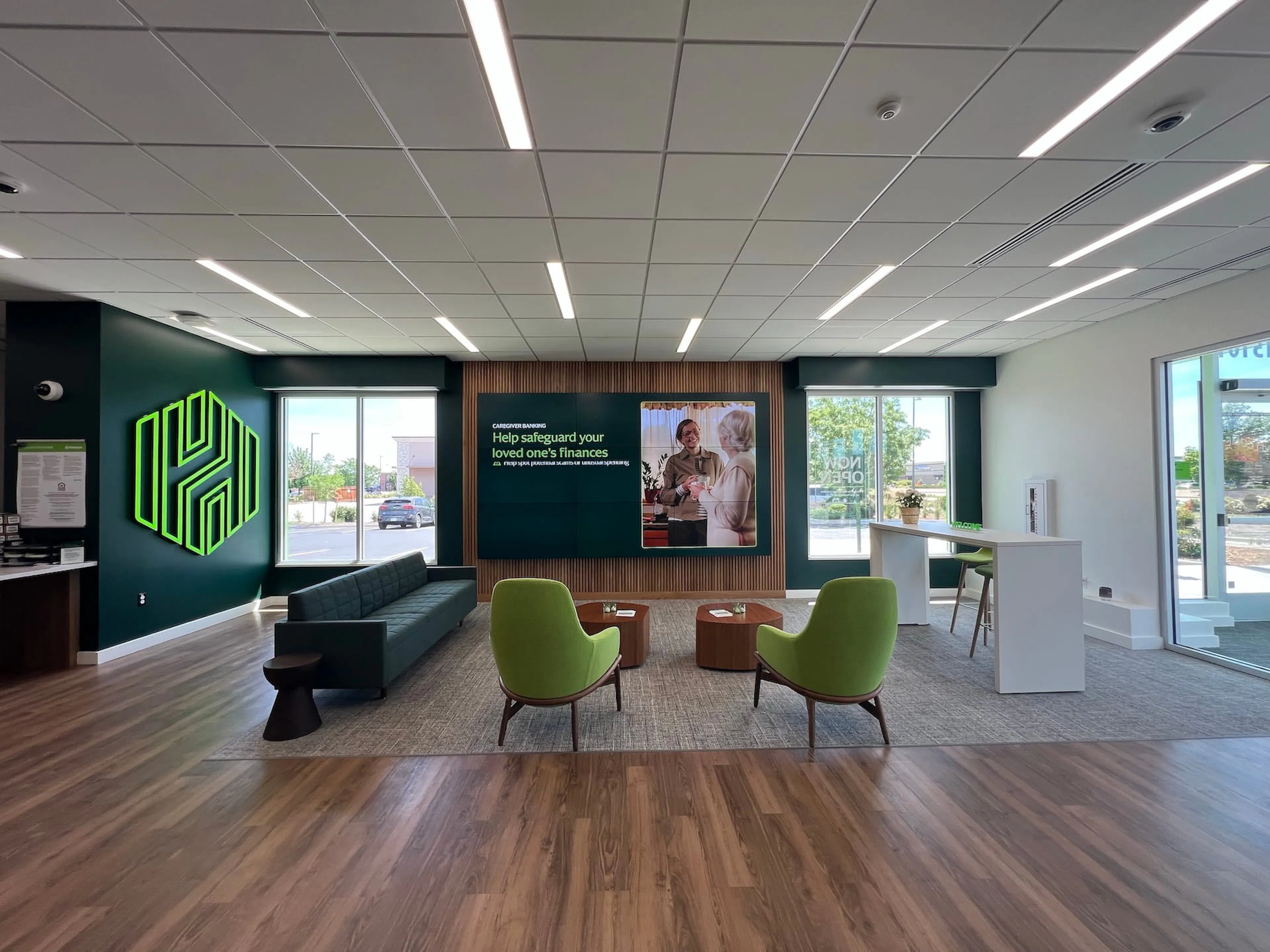 Bank lobby sitting area with informational digital signage