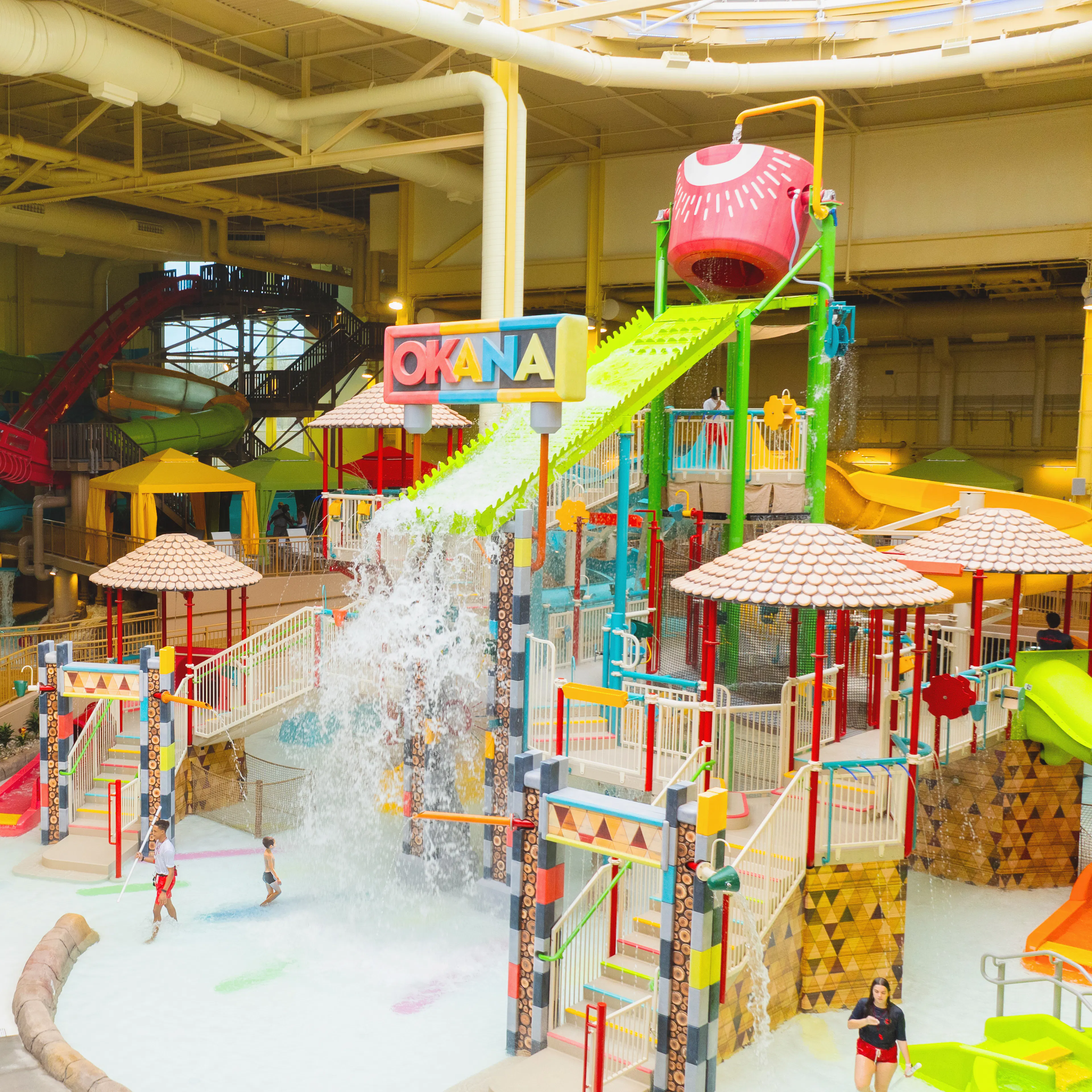 Interior of OKANA resort and water park with brightly colored rides