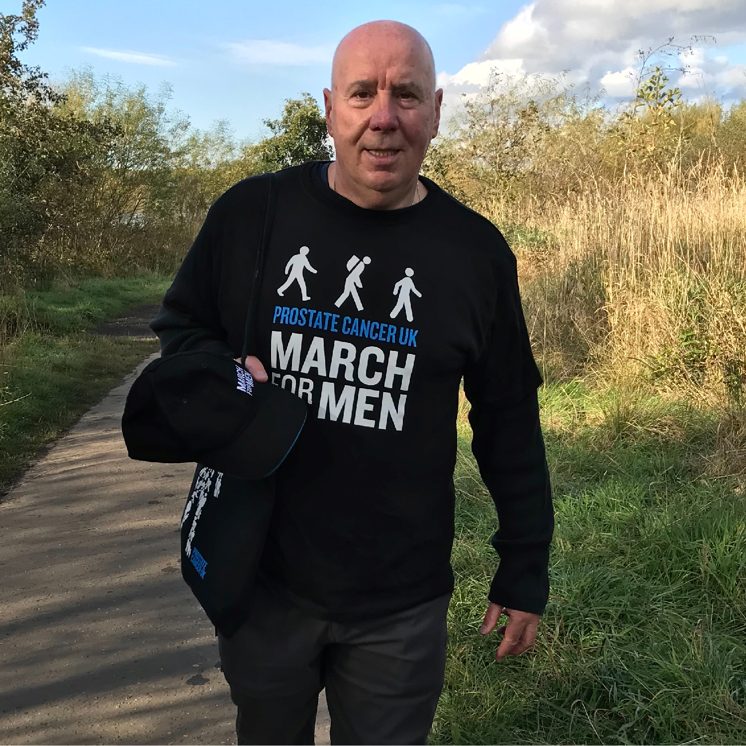 Man walking and looking at camera