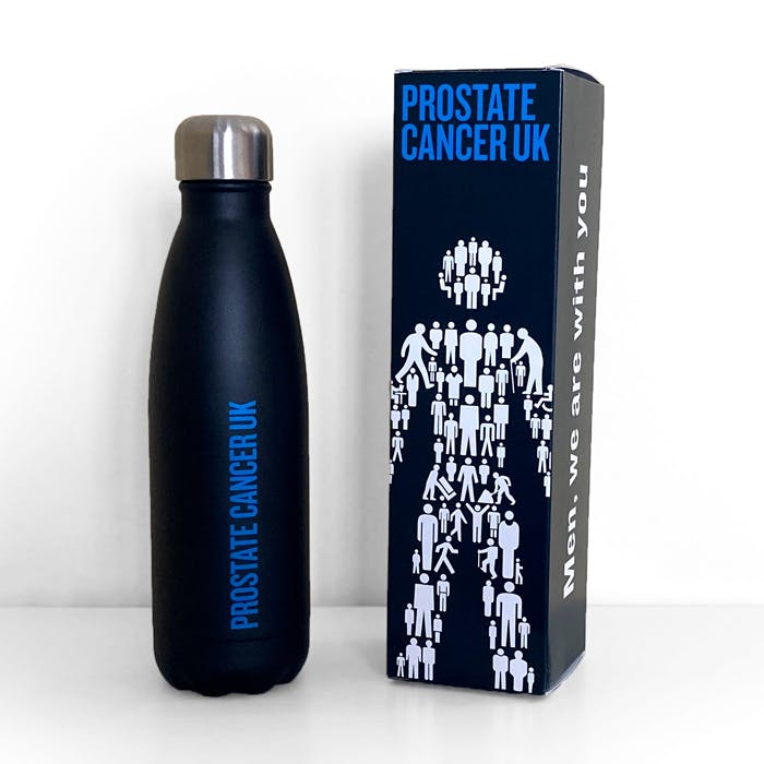 Black reusable water bottle with “Prostate Cancer UK” text next to a matching box featuring white human figure graphics.