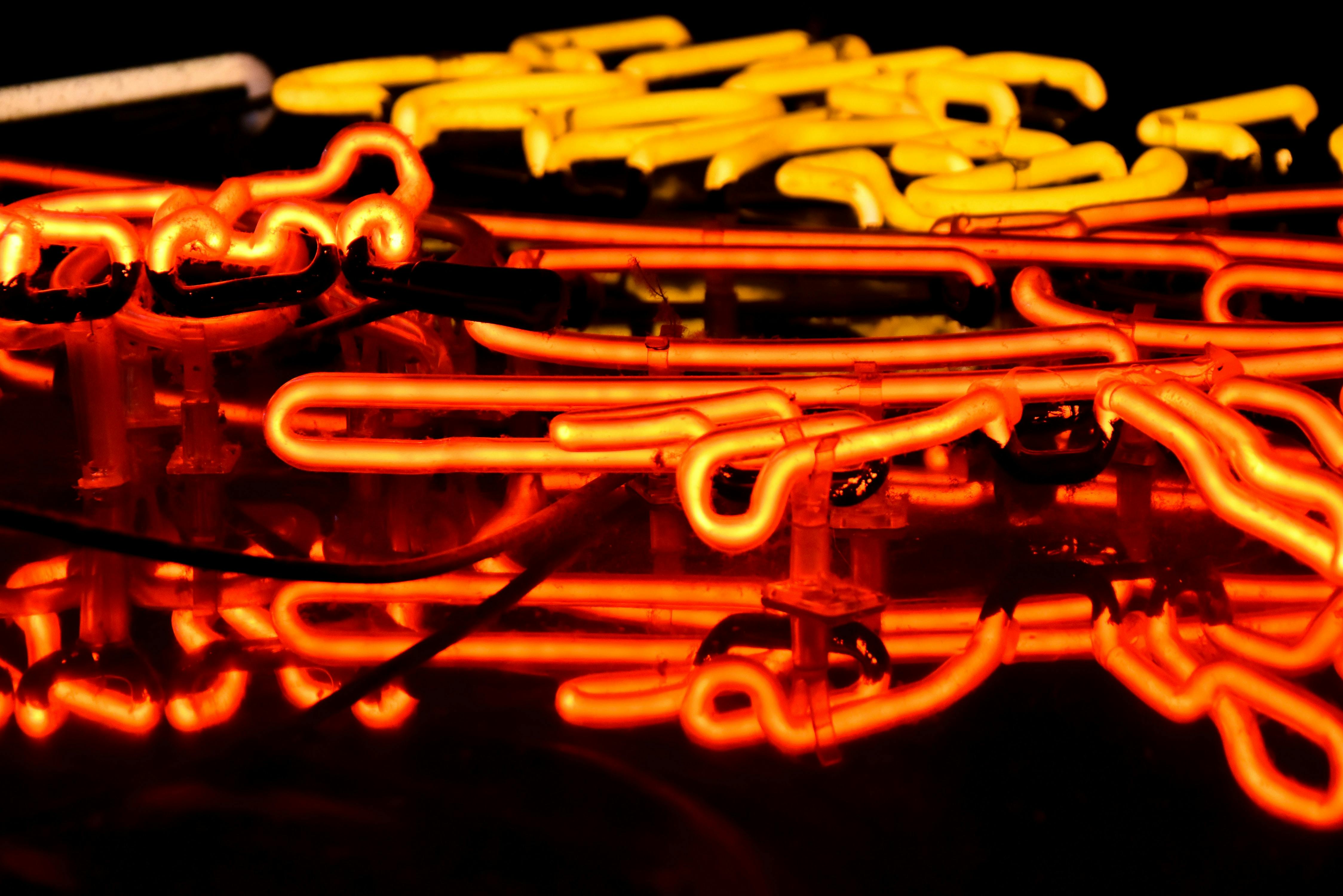 Closeup of orange and yellow neon lights