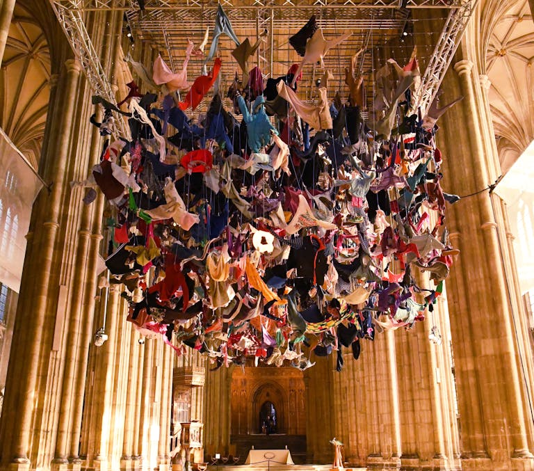 Artwork hung in Canterbury Cathedral made from refugee clothes suspended from the ceiling