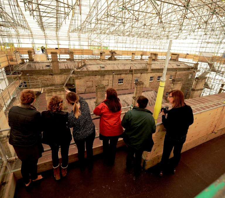 Visitors on the roof scaffold at Dyrham Park