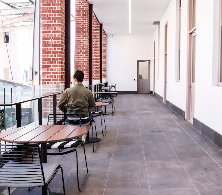 Workspaces in use within the transformed Bice Building: formerly a hospital site, the 1920s building is now a sustainable, inclusive, and creative workspace. 