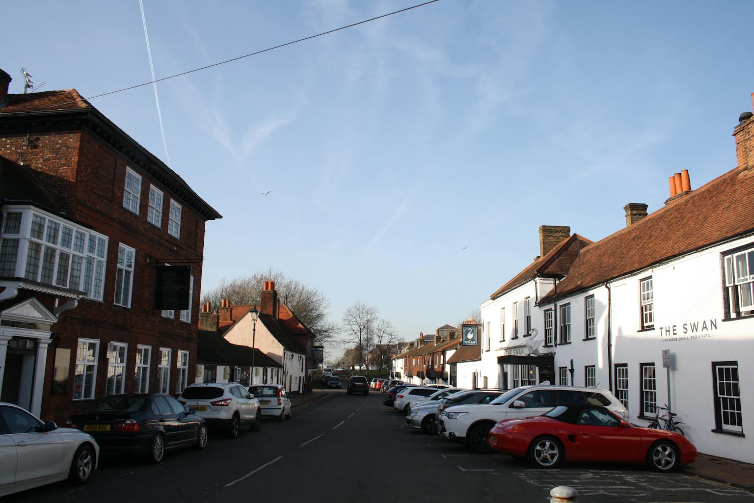 The Hythe, the principal street within the compact Egham Hythe Conservation Area