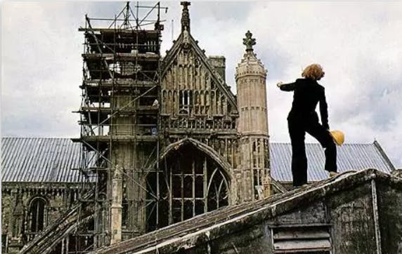 Corinne Bennett working atop Winchester Cathedral, 1980s