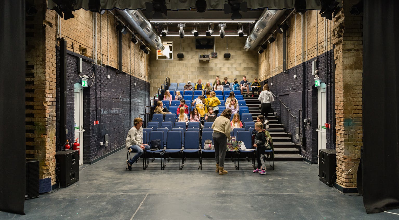 Child and youth actors preparing for class at the renovated Spencer Mill, now an arts centre, in Soham