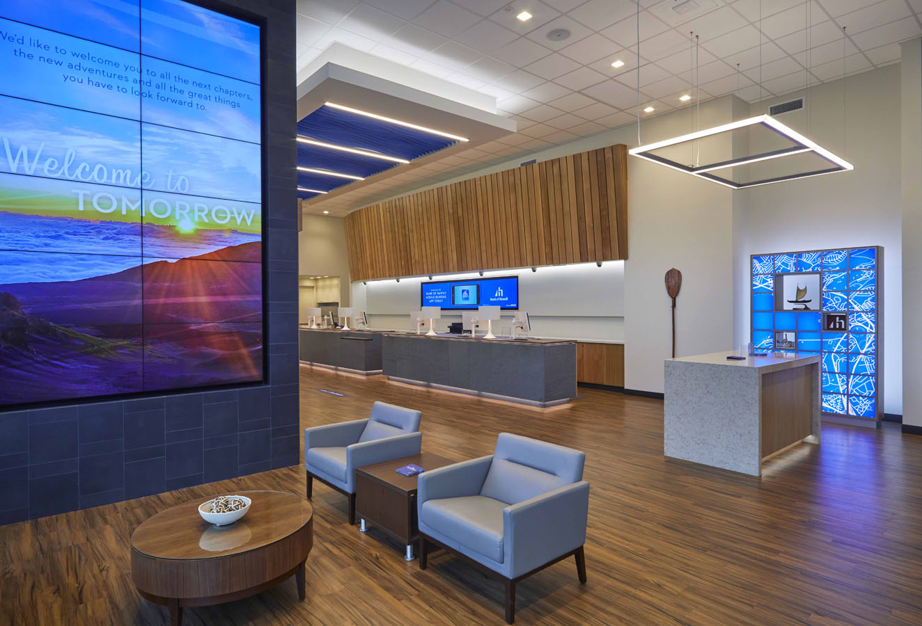 Entryway at Bank of Hawaii at Pearlridge with large television, chairs, and tellers