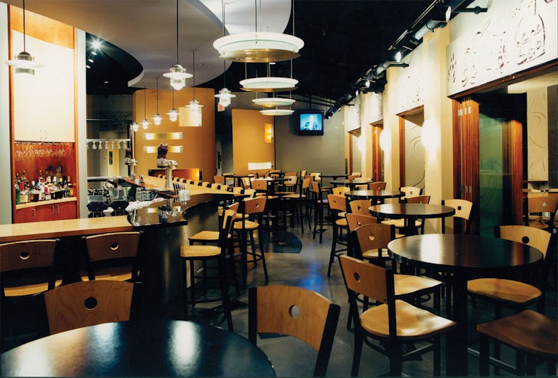 Interior photo of Brew Moon Restaurant & Microbrewery with bar tables and stools