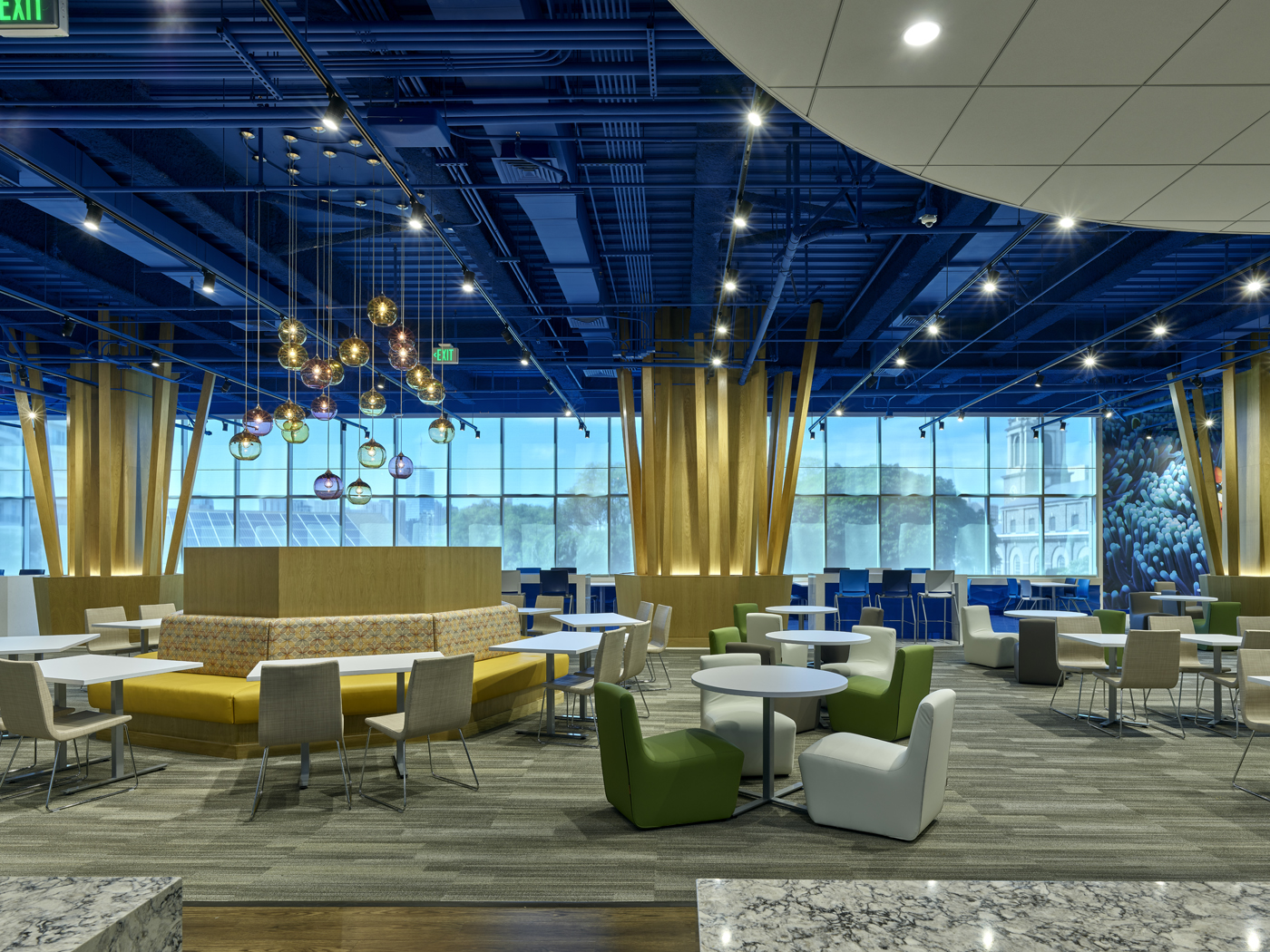 Dining area with blue ceiling and natural wood