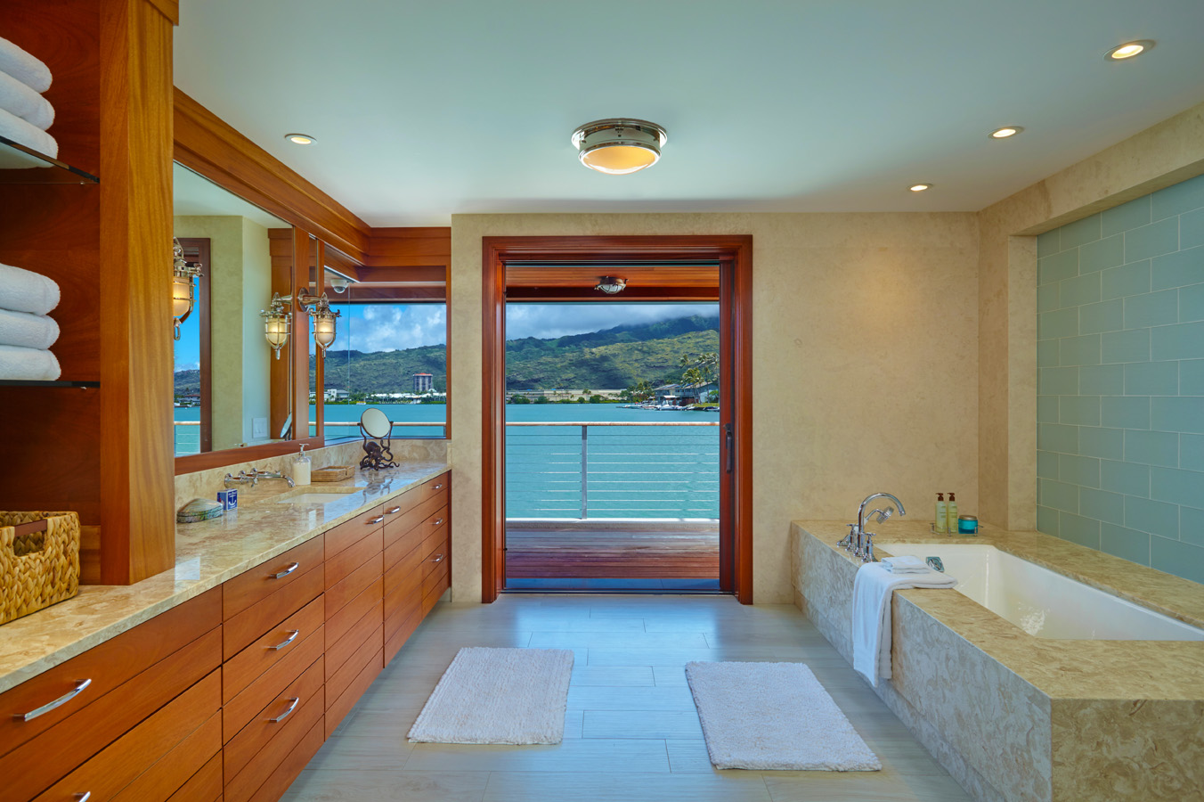 Bathroom with stone tub and doorway to balcony