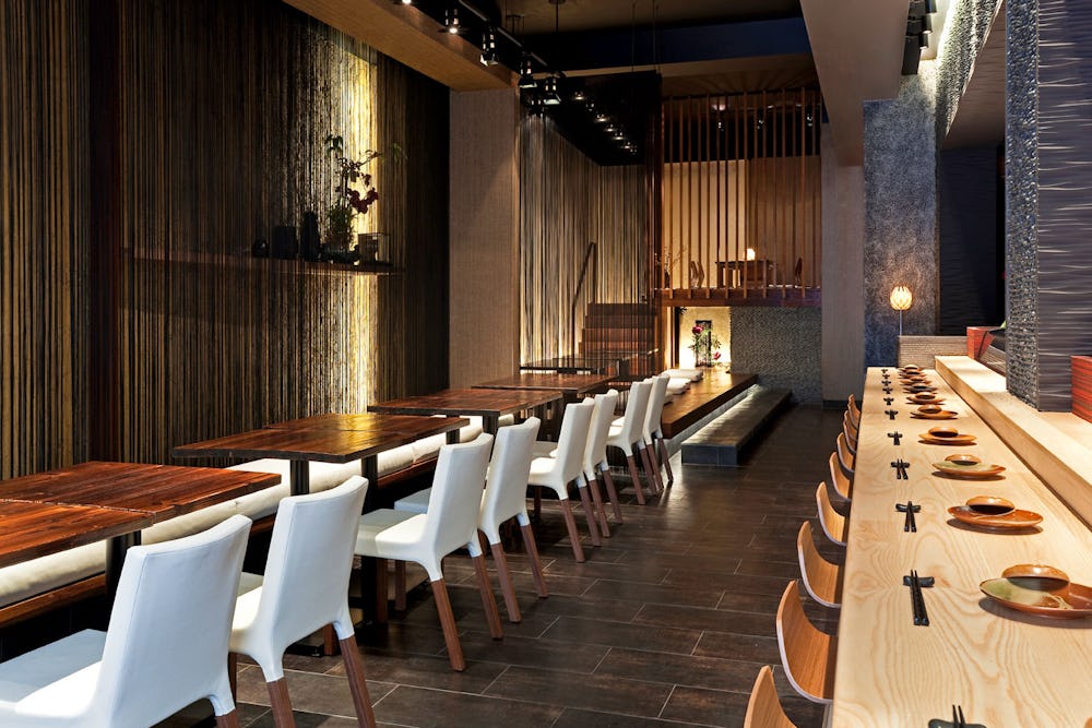 Interior of restaurant with tables and bar seating