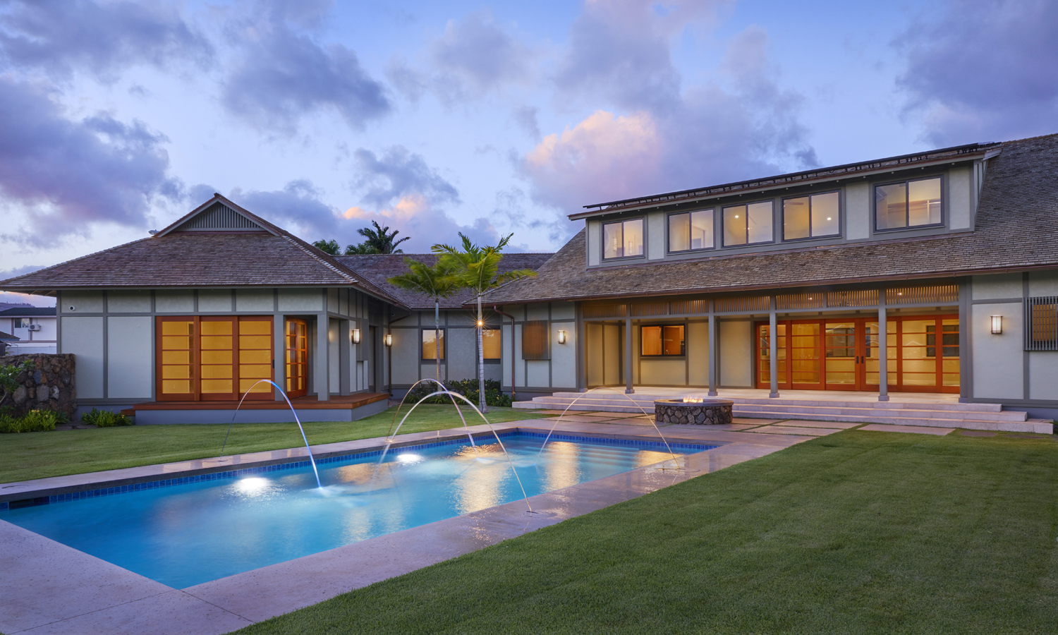Exterior photo of house with pool and fountains