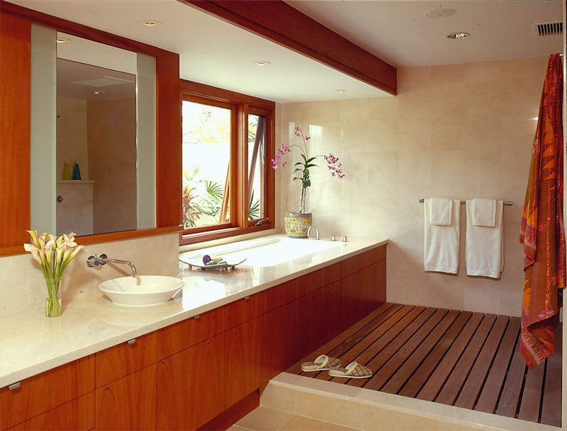 Bathroom with tub and wood slat flooring