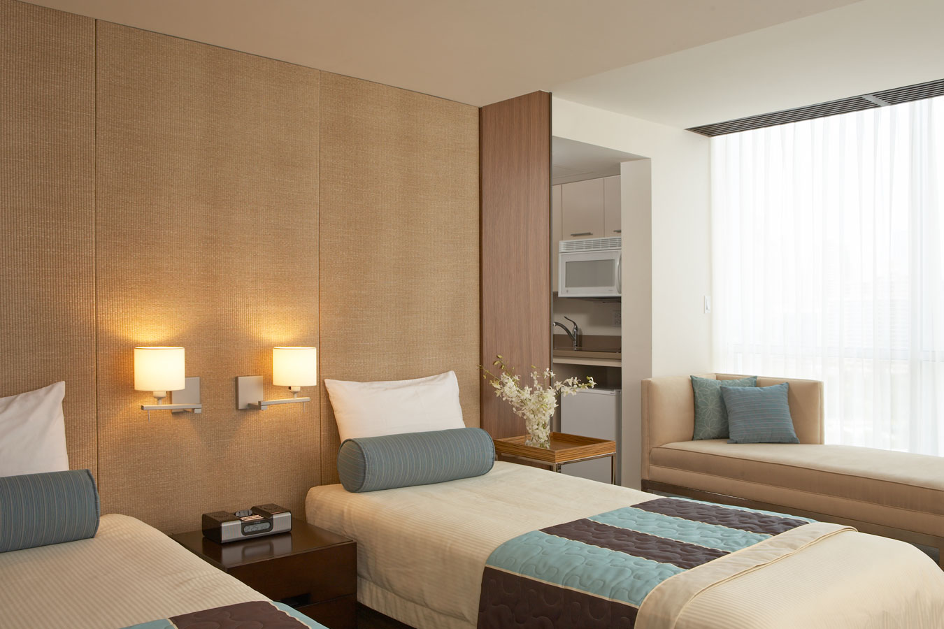 Twin beds in suite configuration.