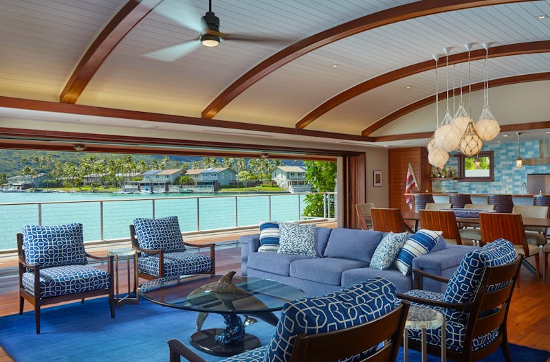 Living room with open access to balcony overlooking ocean