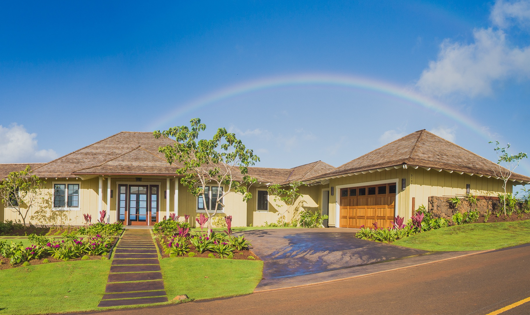 Residence with rainbow backdrop.