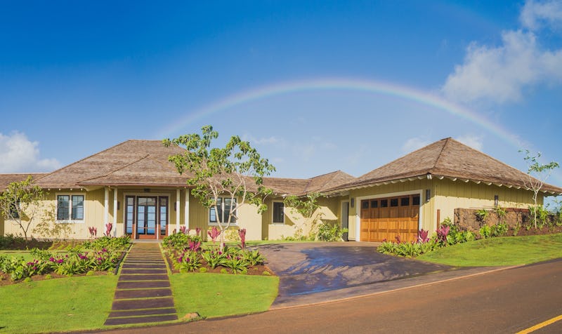 Residence with rainbow backdrop.