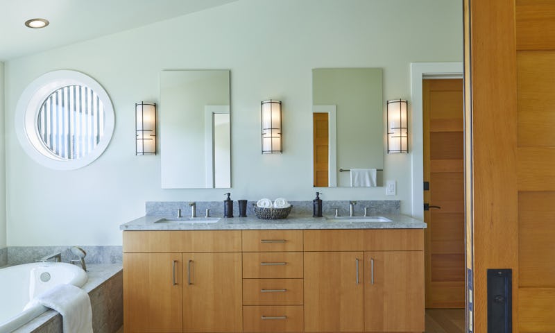 Bathroom with dual sinks and tub