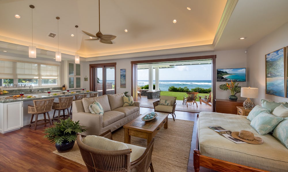 Living room and kitchen photo looking out toward ocean