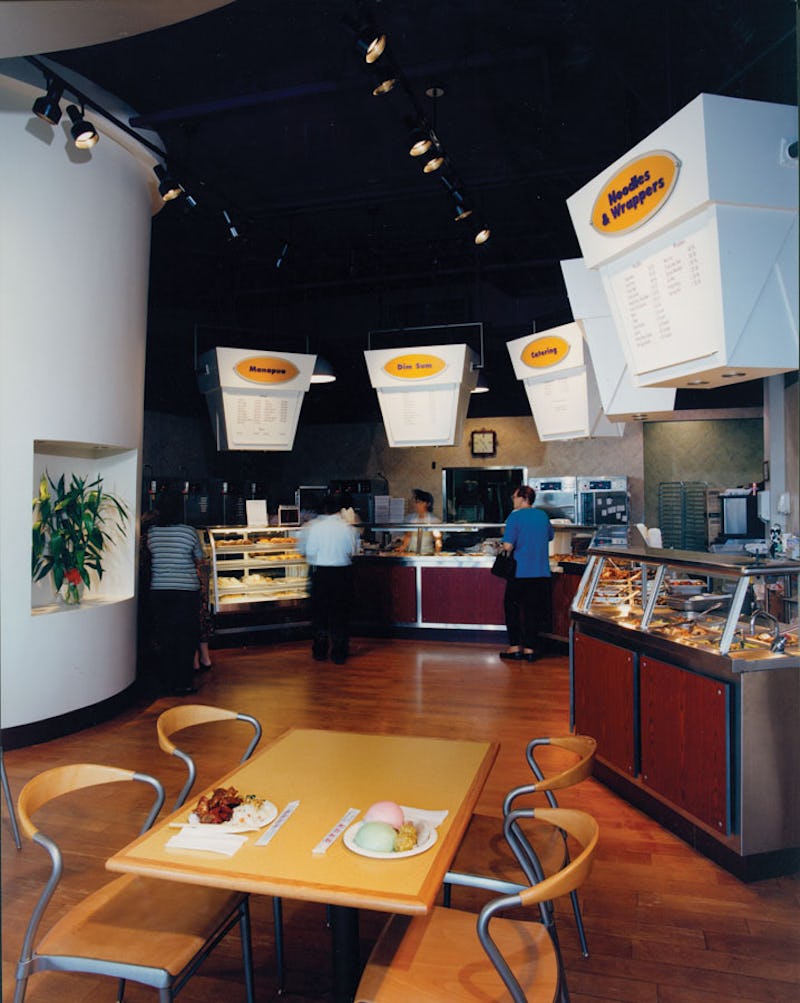 Interior photo of Chun Wah Kam Noodle Factory with menus on giant takeout boxes
